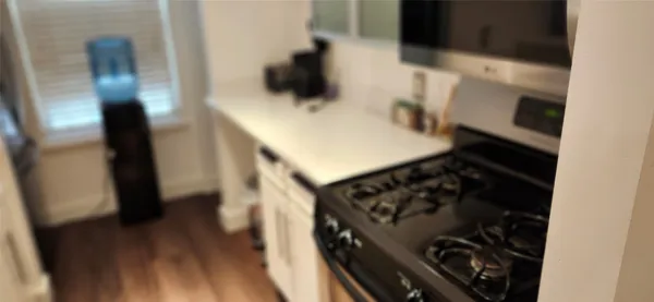 a kitchen with a stove and a refrigerator