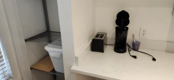 a kitchen with a microwave and cabinets