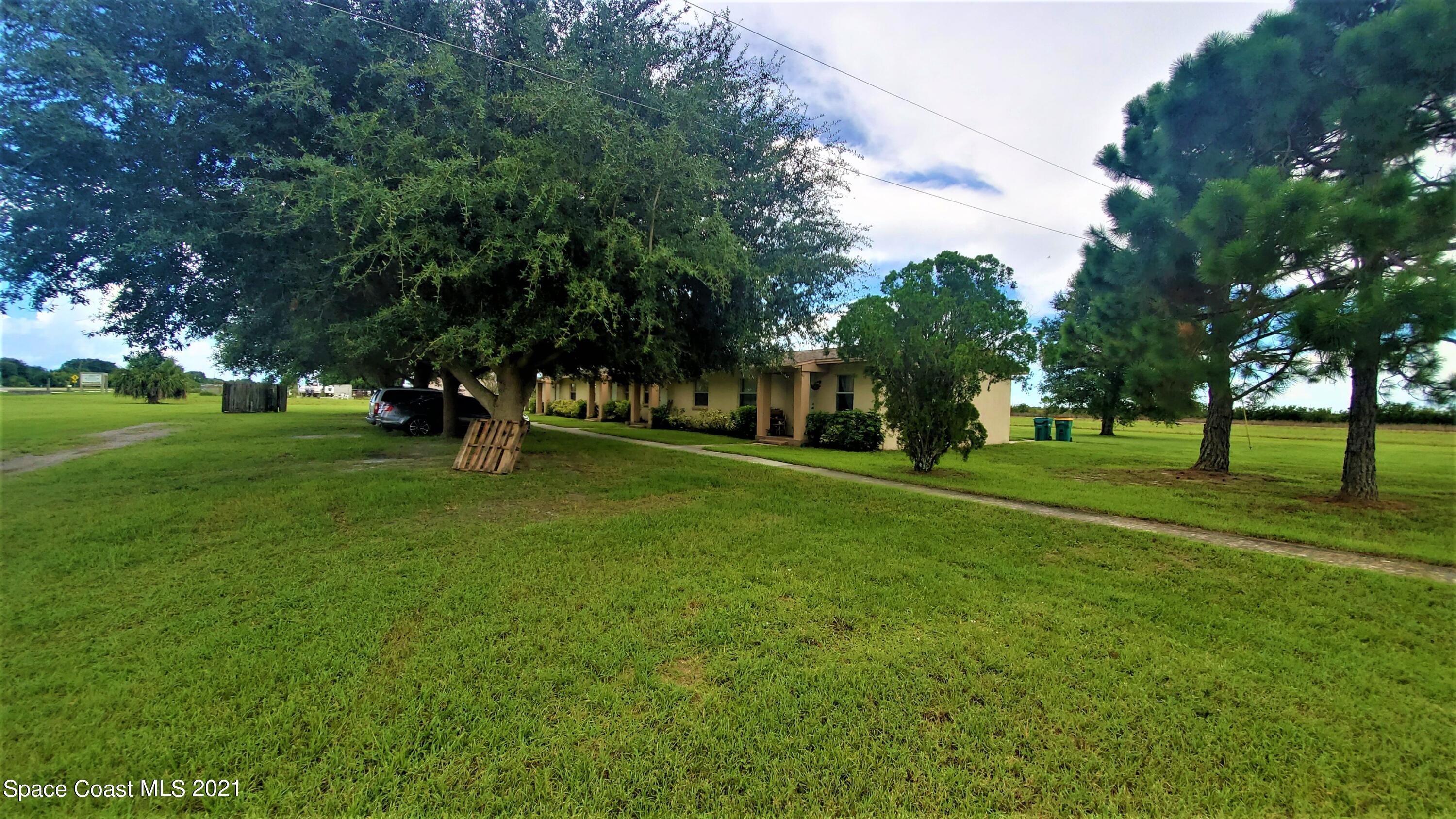 a view of a park with tree s