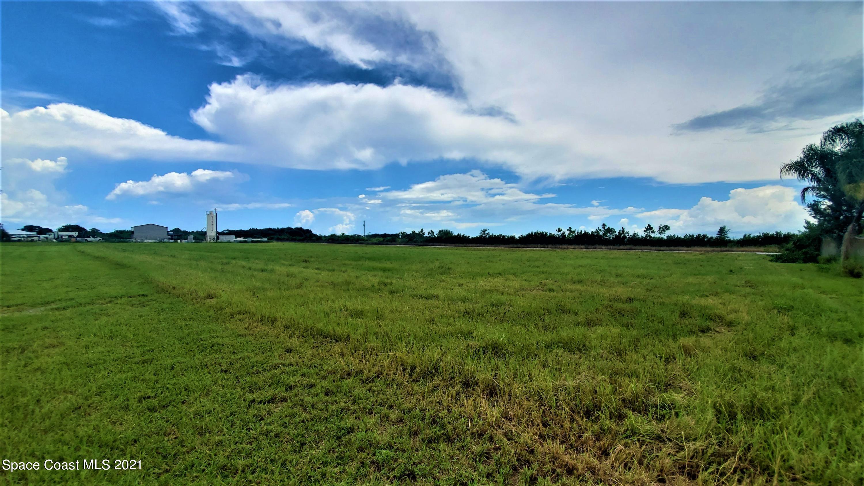 4521 Micco Road Micco, FL 32976 - Photo 11 of 12 a view of a big yard with large trees