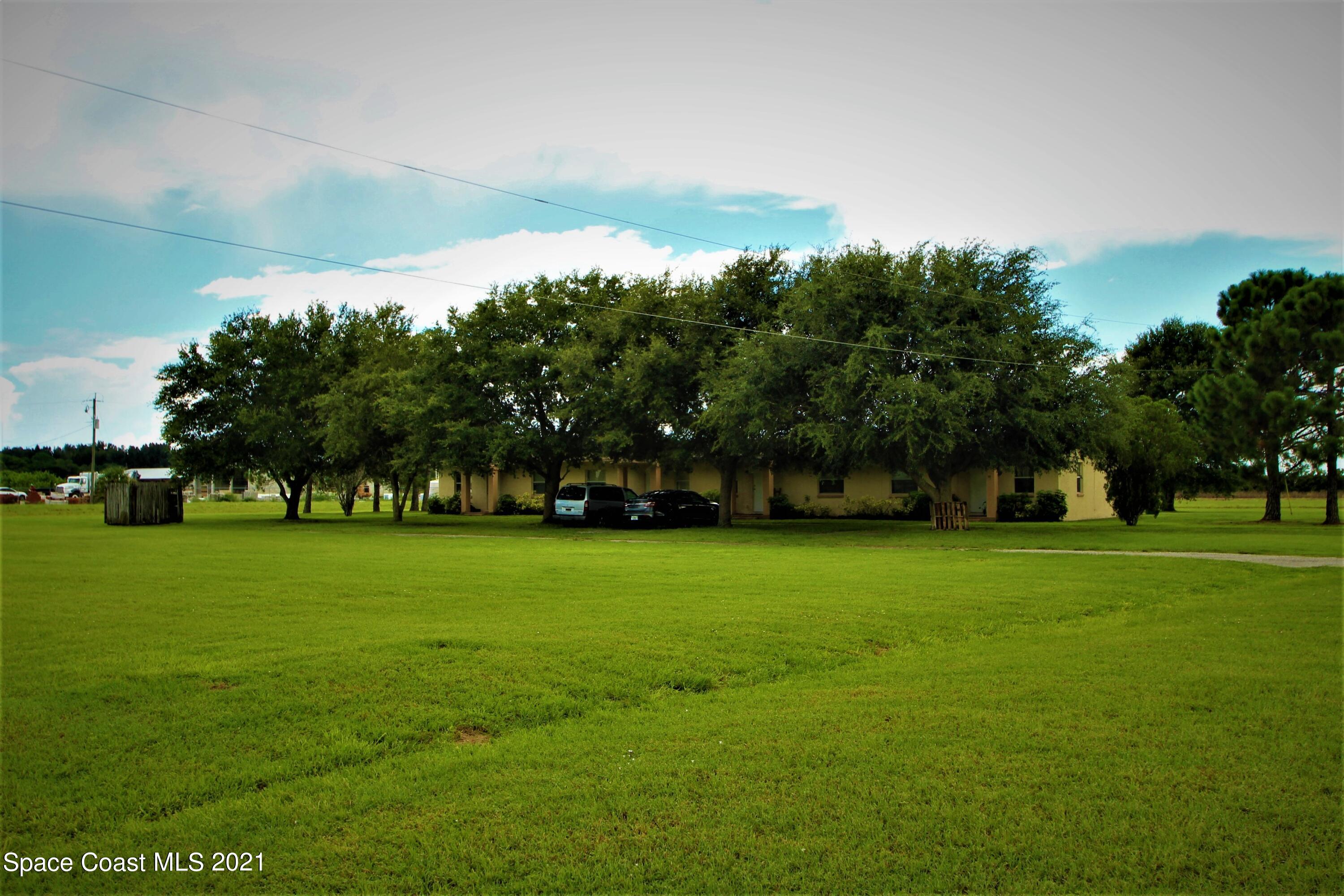 4521 Micco Road Micco, FL 32976 - Photo 3 of 12 a view of a trees in a yard