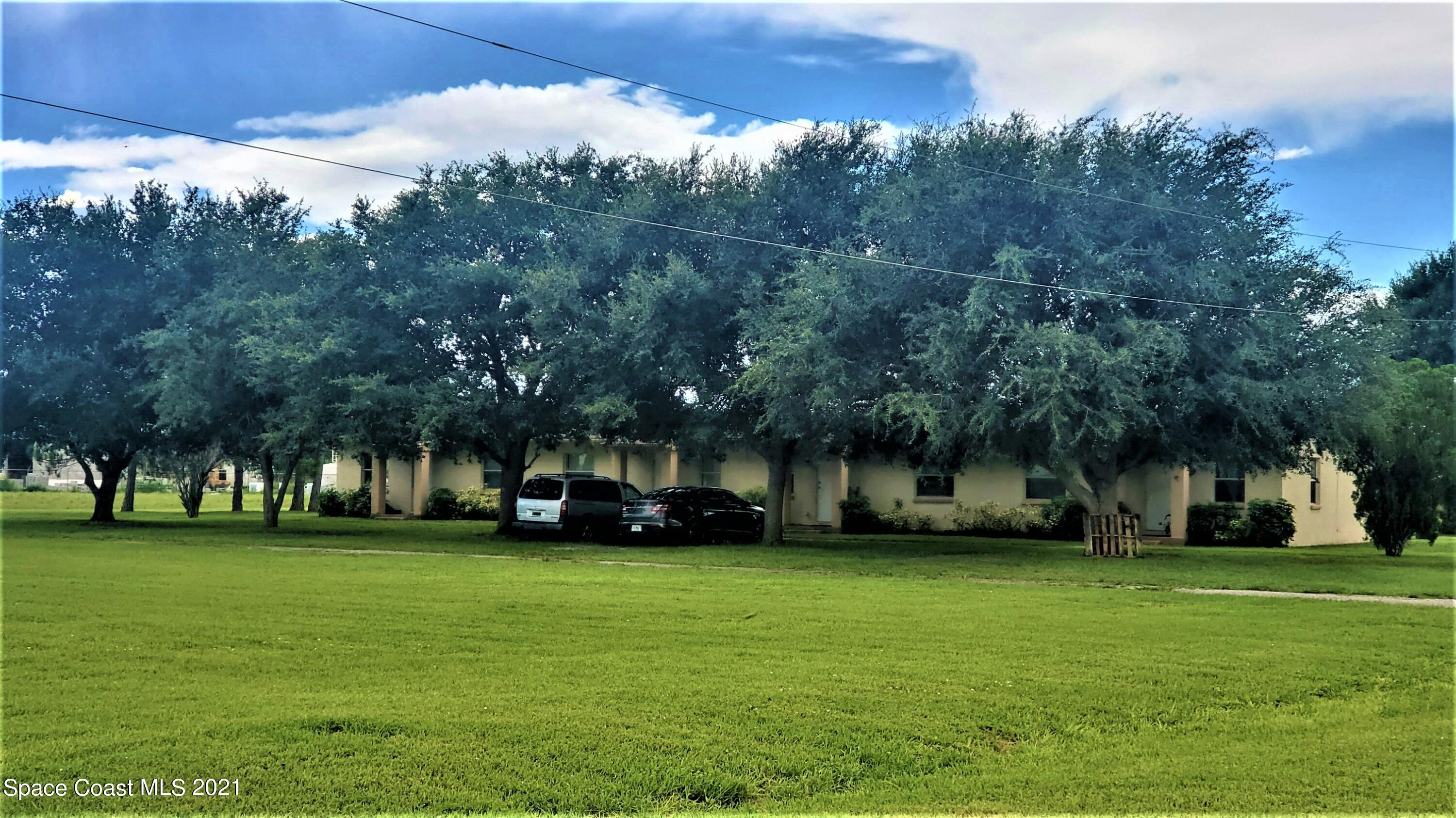 4521 Micco Road Micco, FL 32976 - Photo 5 of 12 a view of a park with large trees