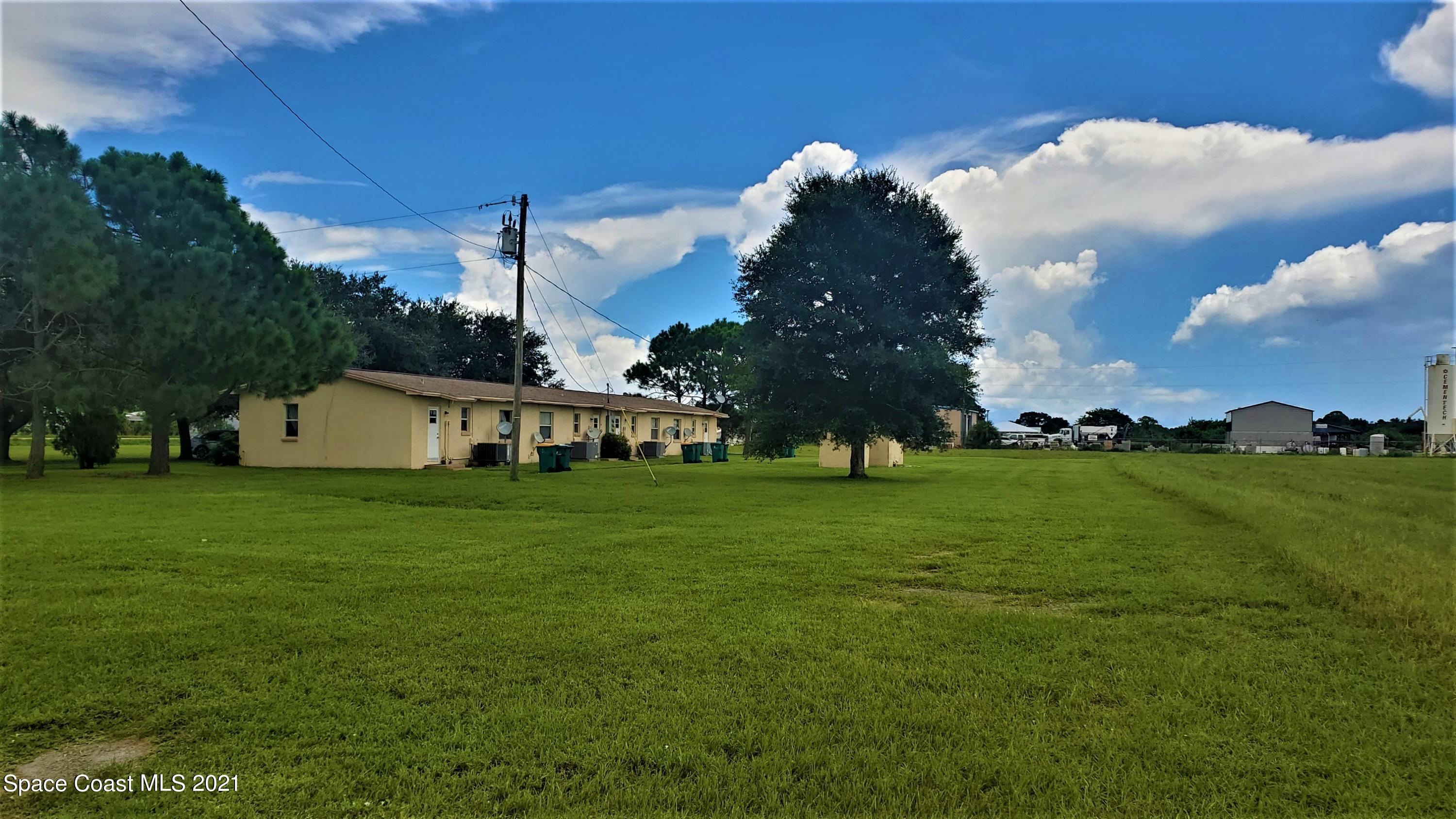 4521 Micco Road Micco, FL 32976 - Photo 10 of 12 a view of a house with a big yard