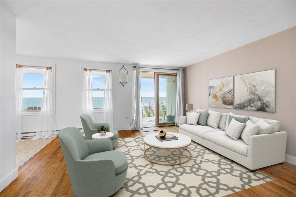 544 Shore Road, Unit 3 Truro, MA 02666 - Photo 19 of 30 a living room with furniture and a large window