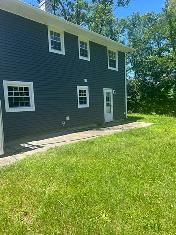 a backyard of a house with lots of green space