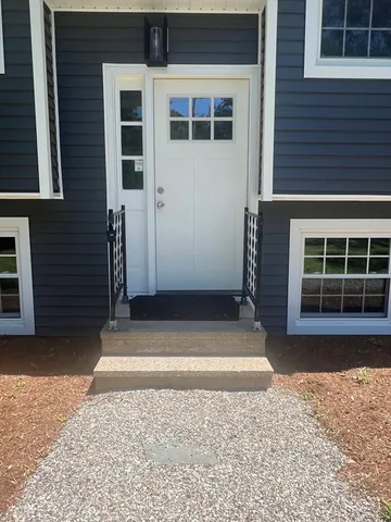 a view of a house with a door and a window
