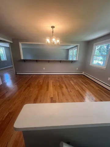 a view of room with window and hardwood floor