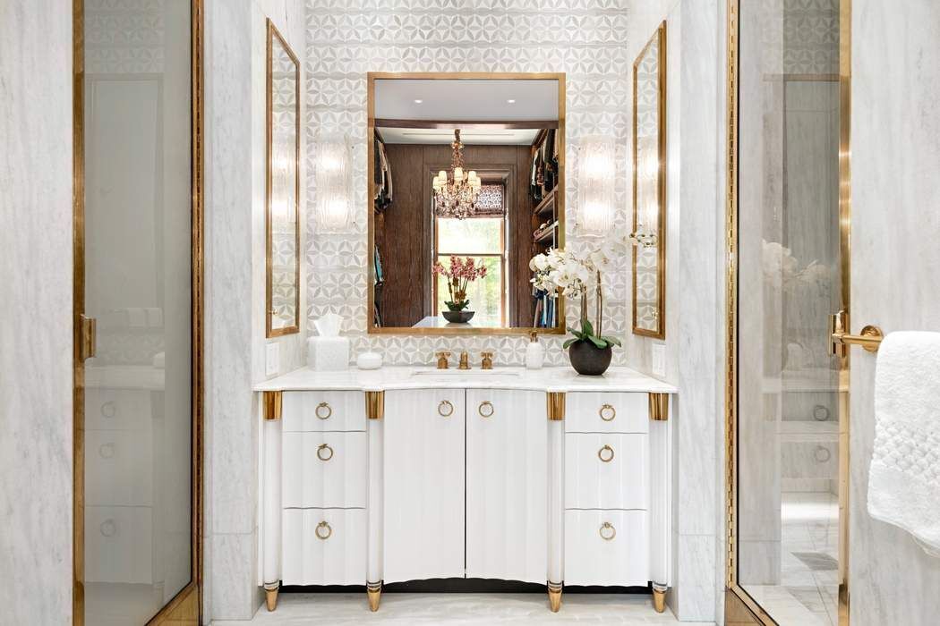 1 West 72nd Street, Unit 1011 Manhattan, NY 10023 - Photo 10 of 14 a bathroom with a sink and a mirror