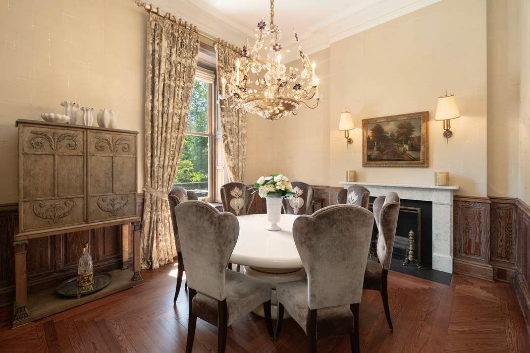 1 West 72nd Street, Unit 1011 Manhattan, NY 10023 - Photo 6 of 14 a view of a dining room with furniture window and wooden floor
