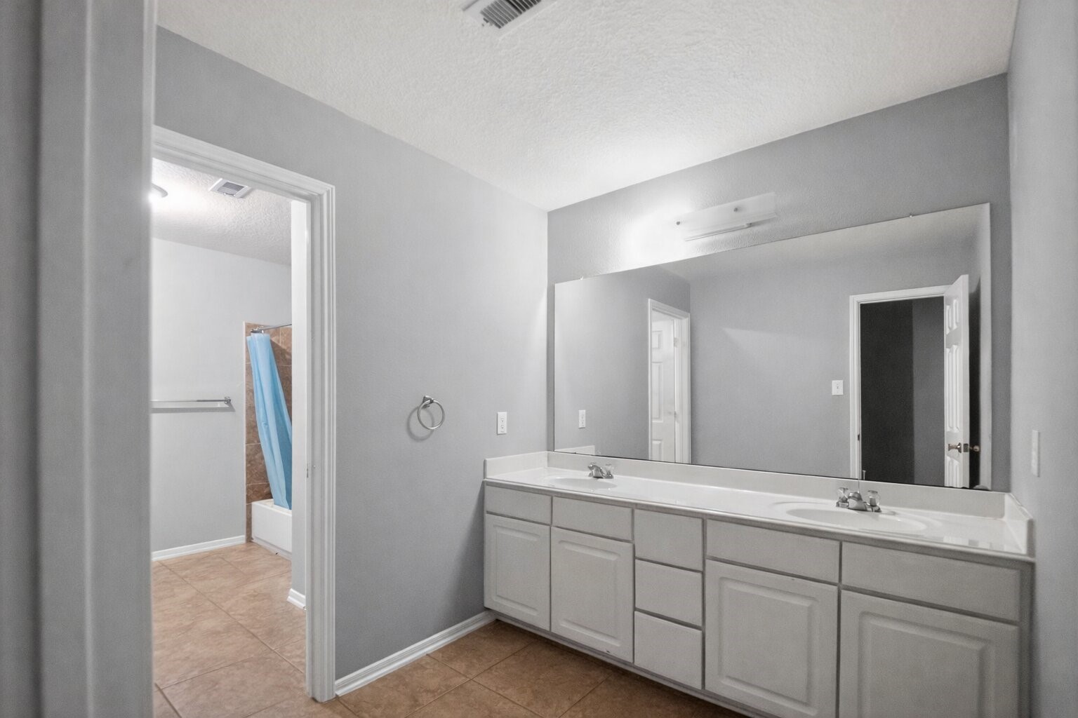 7902 Sesame Street Baytown, TX 77521 - Photo 18 of 24 a bathroom with double sink and mirror