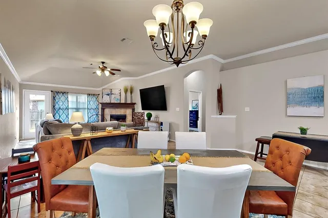 a view of a dining room with furniture wooden floor and chandelier
