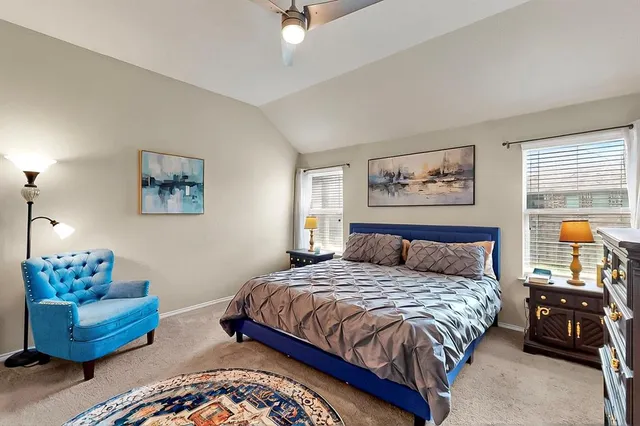 a bedroom with a bed and a couch