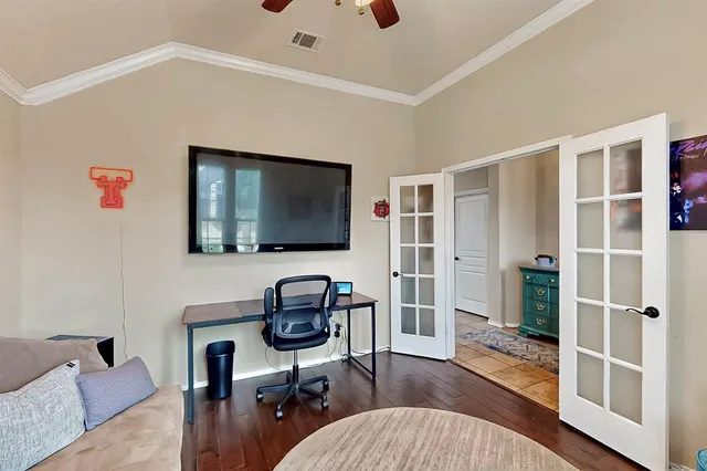a livingroom with workspace and a couch