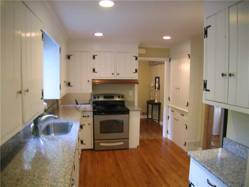 1 Devon Road Darien, CT 06820 - Photo 3 of 19 a kitchen with stainless steel appliances granite countertop a stove a sink and a refrigerator