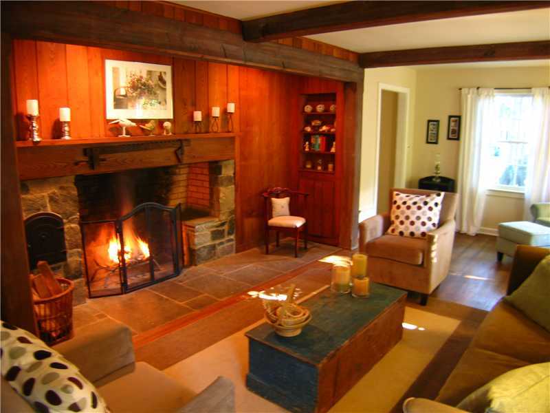 1 Devon Road Darien, CT 06820 - Photo 7 of 19 a living room with furniture and a fireplace