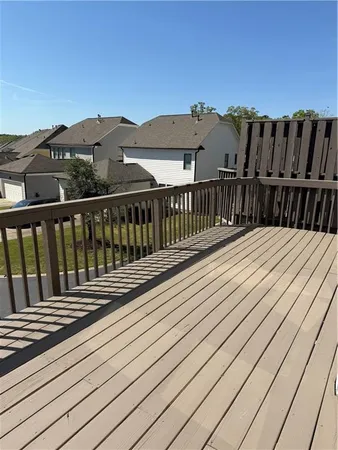 a view of deck with wooden floor and fence
