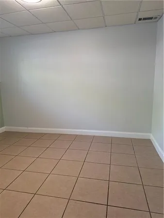 a view of a room and an empty room