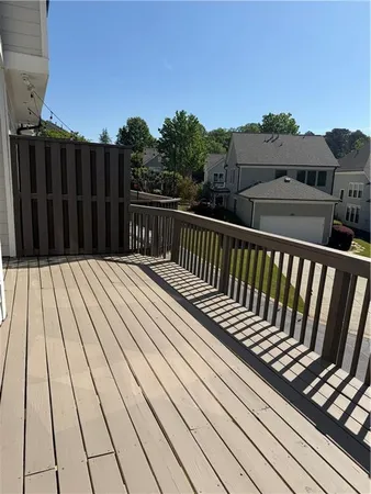 a view of balcony with wooden floor