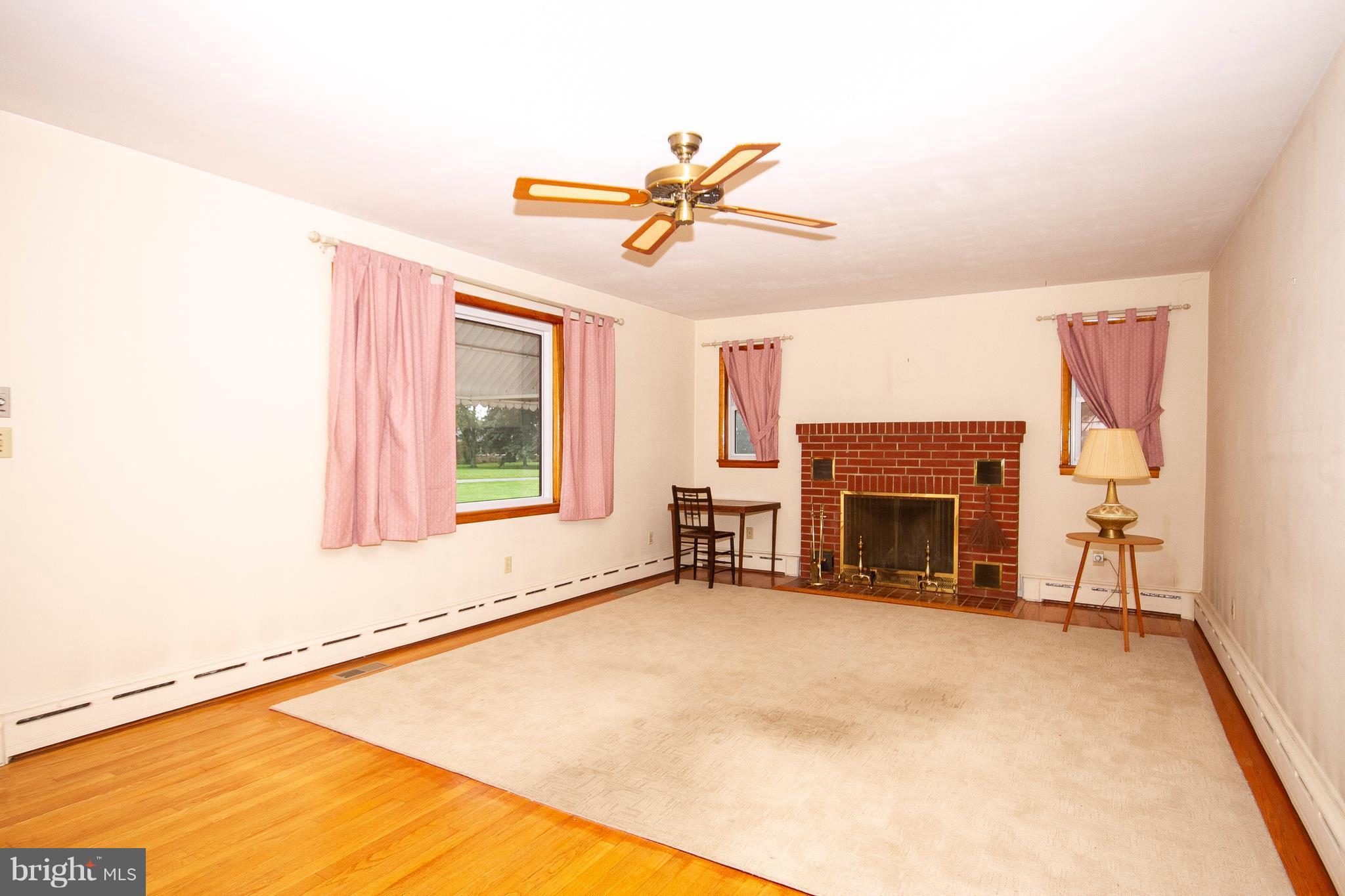 1908 Bulls Sawmill Road Freeland, MD 21053 - Photo 3 of 24 Living Room with wood floors and fireplace