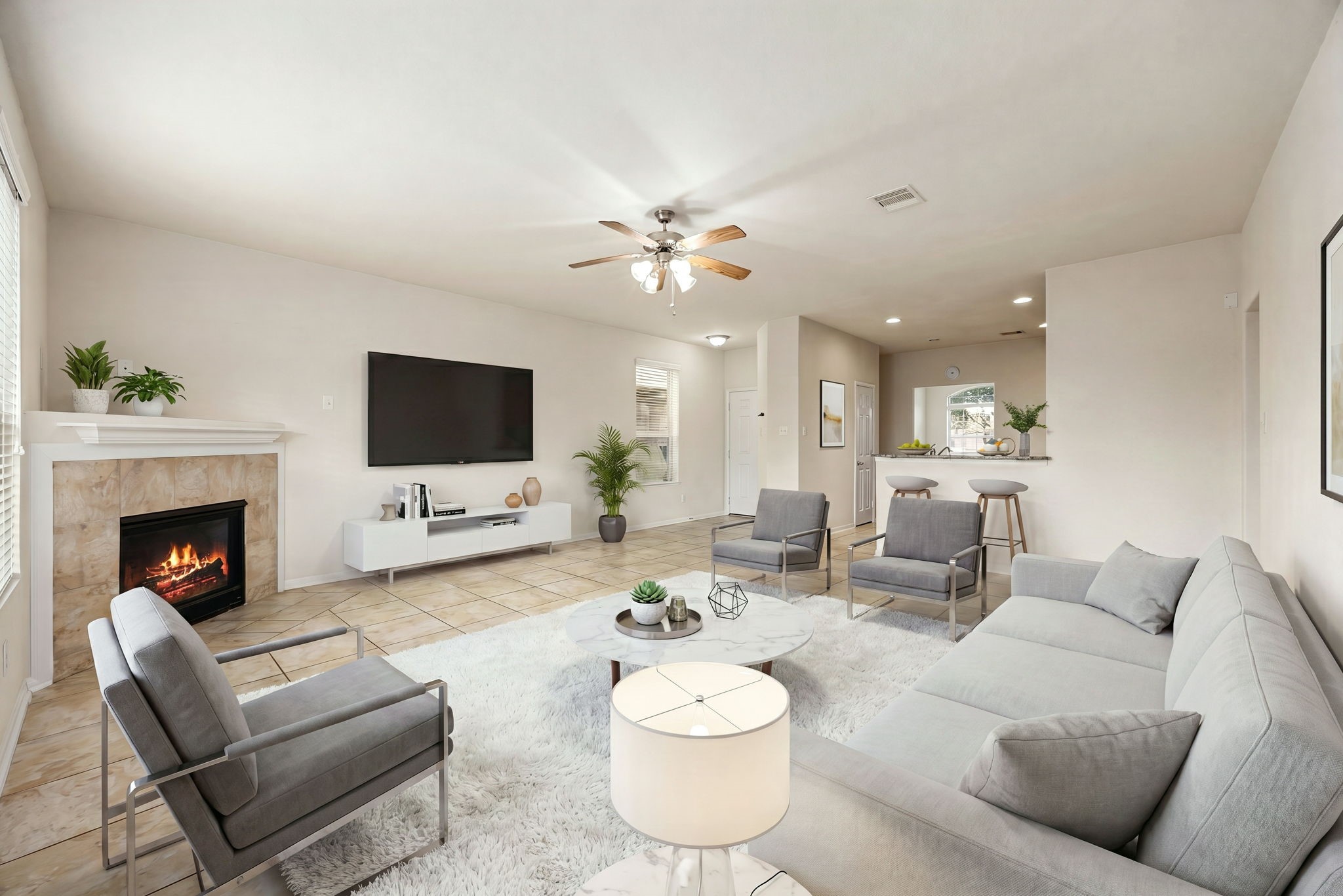 29322 Indian Clearing Spring, TX 77386 - Photo 2 of 47 a living room with furniture a flat screen tv and a fireplace