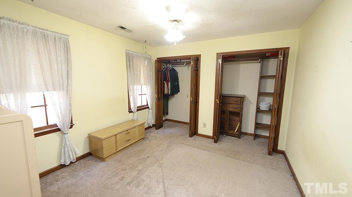 2024 Corberrie Lane Raleigh, NC 27613 - Photo 22 of 30 a view of hallway with bathroom and a window