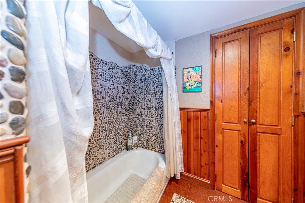 5757 Clouds Rest Mariposa, CA 95338 - Photo 12 of 68 a bathroom with a bathtub and shower