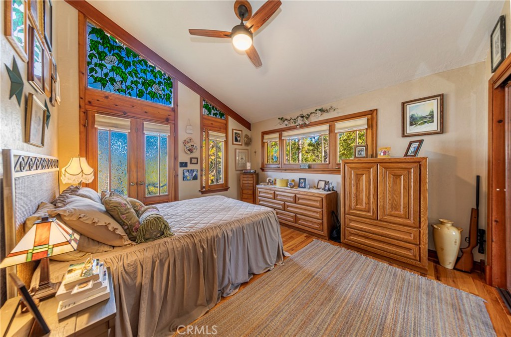 5757 Clouds Rest Mariposa, CA 95338 - Photo 14 of 68 a bedroom with furniture and wooden floor