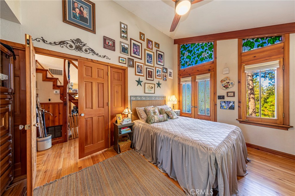 5757 Clouds Rest Mariposa, CA 95338 - Photo 15 of 68 a bedroom with a bed and a chandelier
