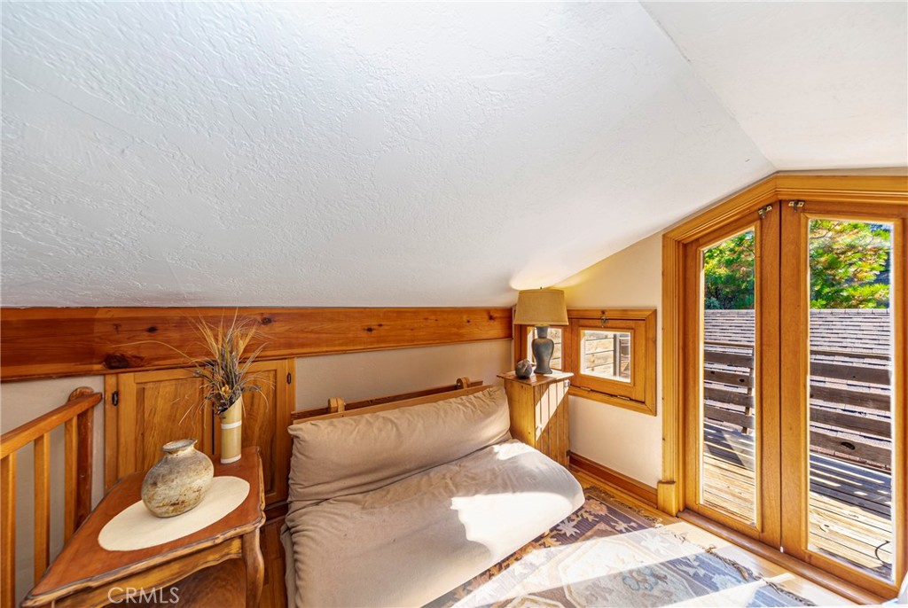 5757 Clouds Rest Mariposa, CA 95338 - Photo 18 of 68 a bed room with a bed and glass windows