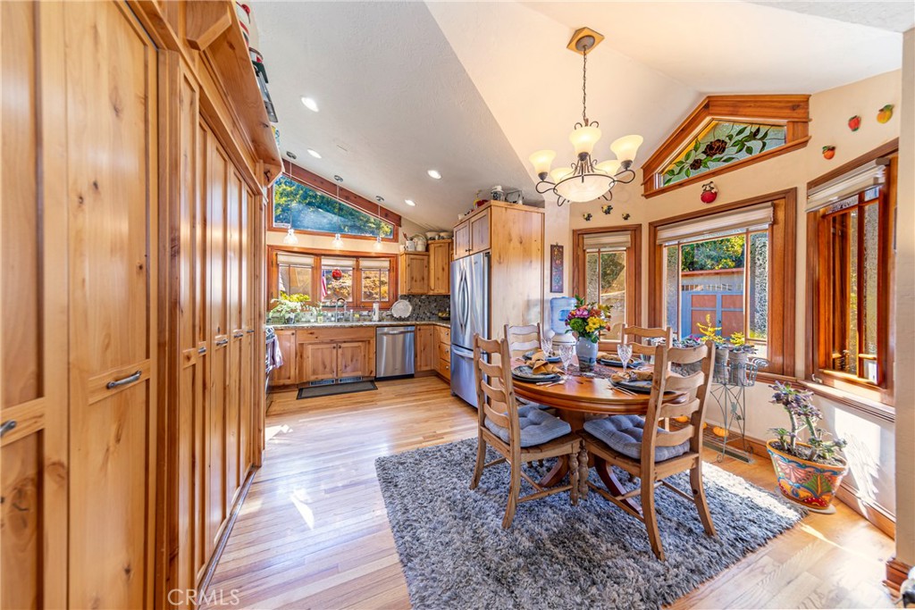 5757 Clouds Rest Mariposa, CA 95338 - Photo 27 of 68 a view of a dining room with furniture and a chandelier