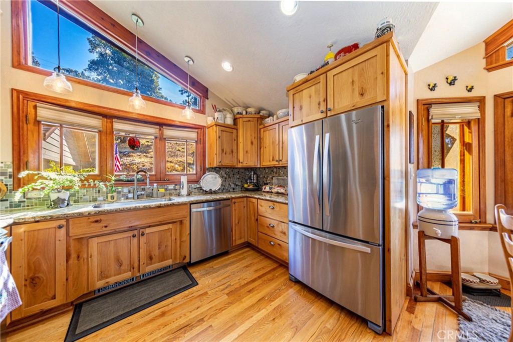 5757 Clouds Rest Mariposa, CA 95338 - Photo 29 of 68 a kitchen with stainless steel appliances granite countertop a refrigerator and a stove