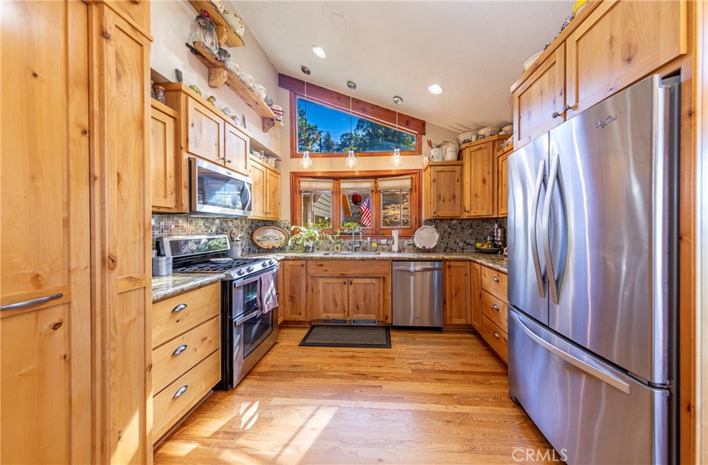 5757 Clouds Rest Mariposa, CA 95338 - Photo 30 of 68 a kitchen with stainless steel appliances granite countertop a refrigerator and a stove top oven