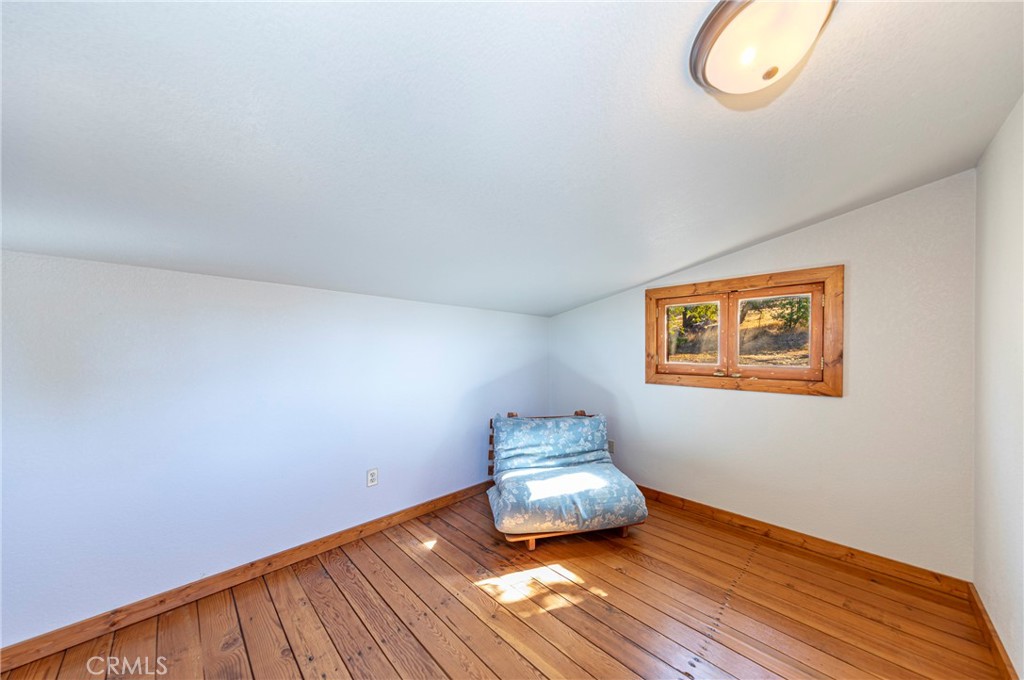 5757 Clouds Rest Mariposa, CA 95338 - Photo 40 of 68 a room with a wooden floor and a window