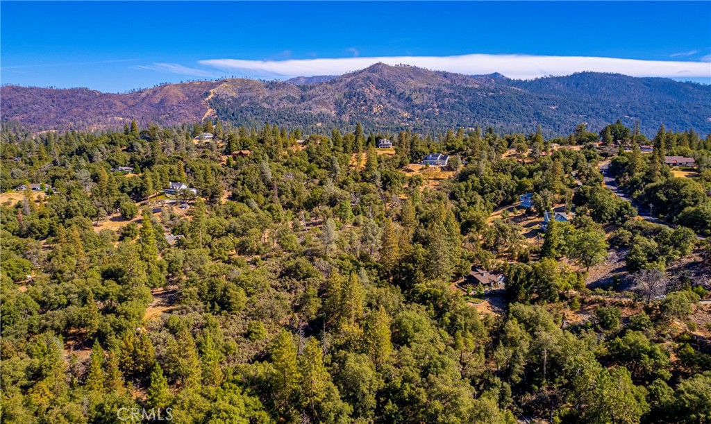 5757 Clouds Rest Mariposa, CA 95338 - Photo 66 of 68 a view of a lush green hillside and a houses