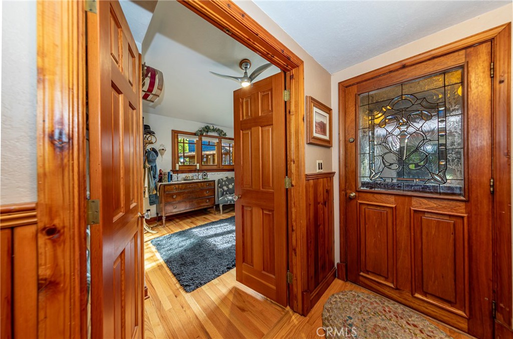 5757 Clouds Rest Mariposa, CA 95338 - Photo 7 of 68 a view of a hallway with wooden floor and furniture
