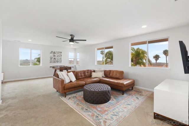 a living room with furniture and a table