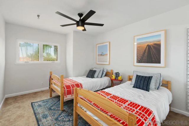 a bathroom with a shower a toilet and a shower