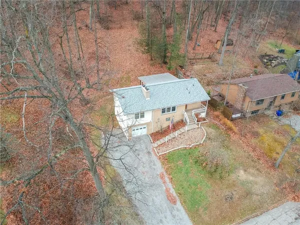 a view of a backyard both side of the house