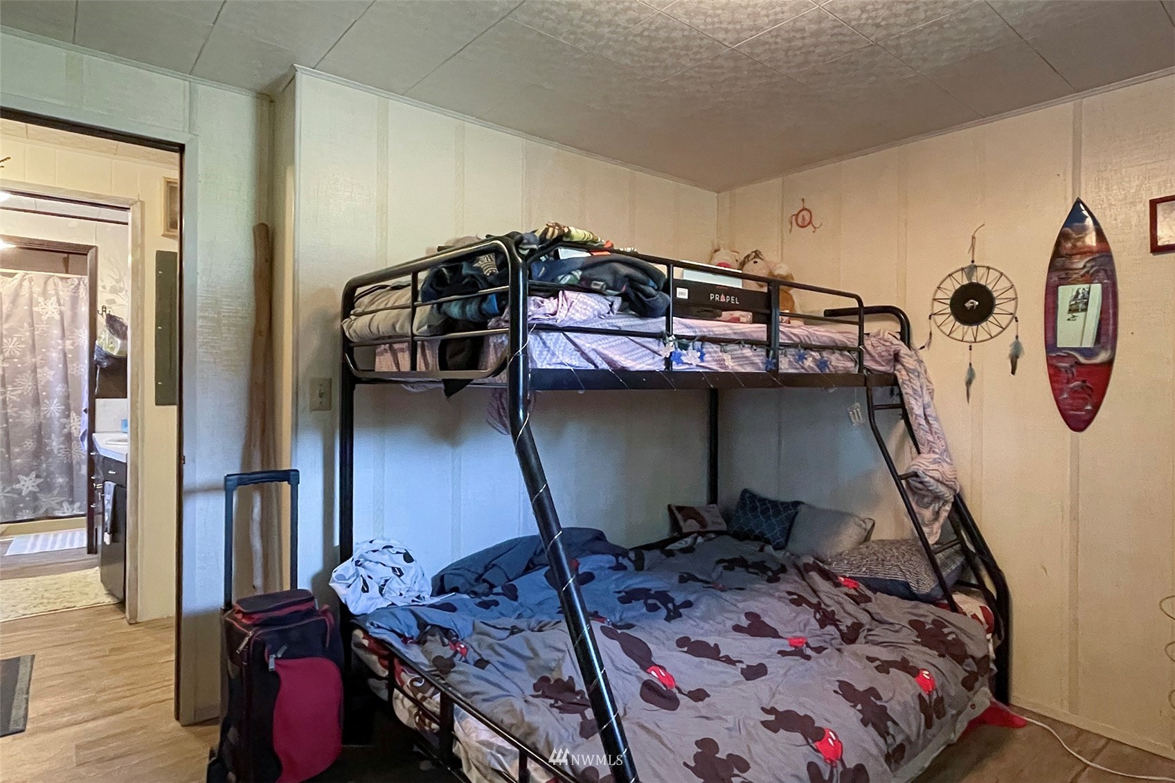 371 Lake Farm Road Port Angeles, WA 98362 - Photo 13 of 36 a bed sitting in a bedroom next to a window