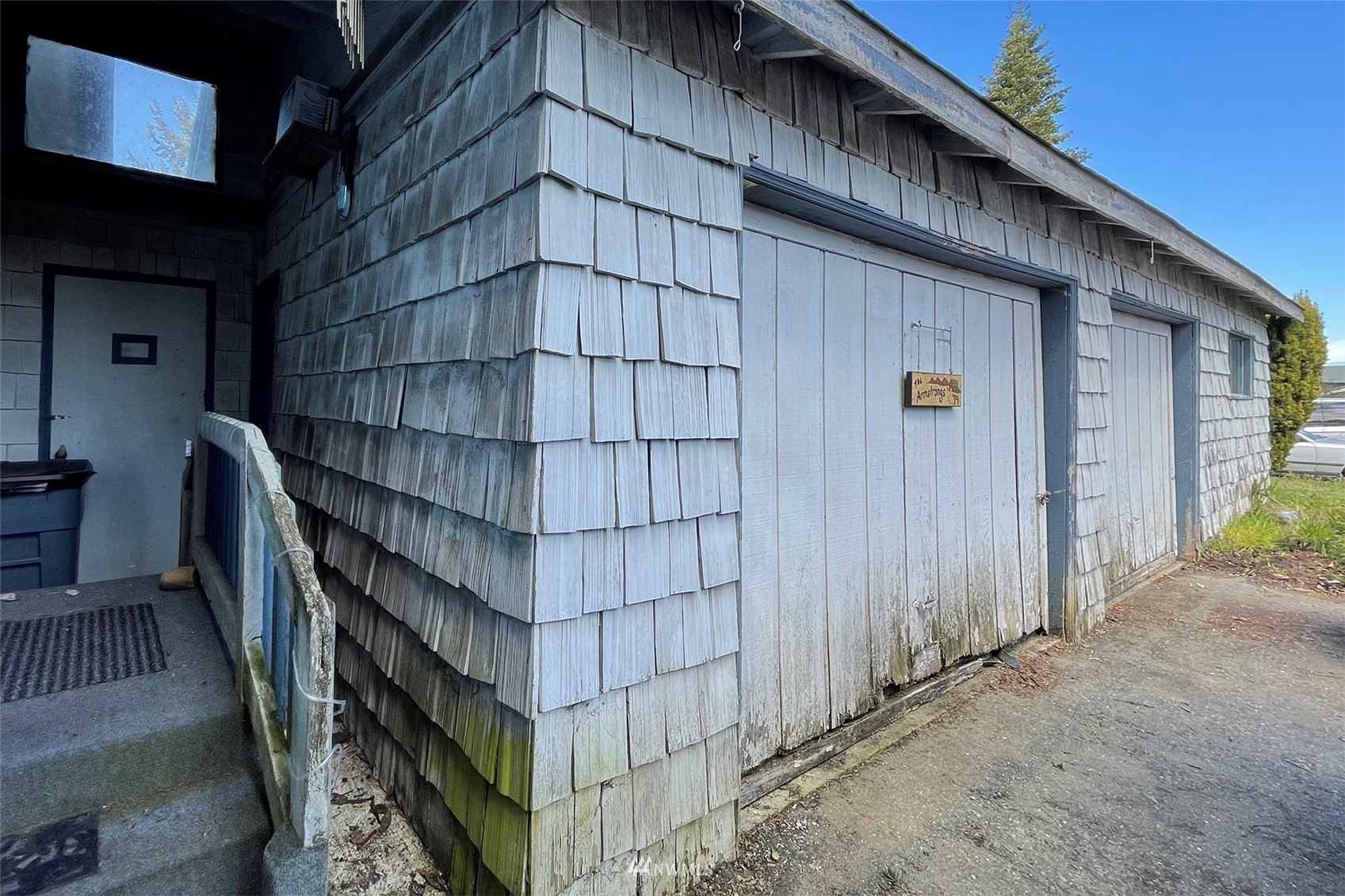 371 Lake Farm Road Port Angeles, WA 98362 - Photo 25 of 36 a front view of a house with wooden fence