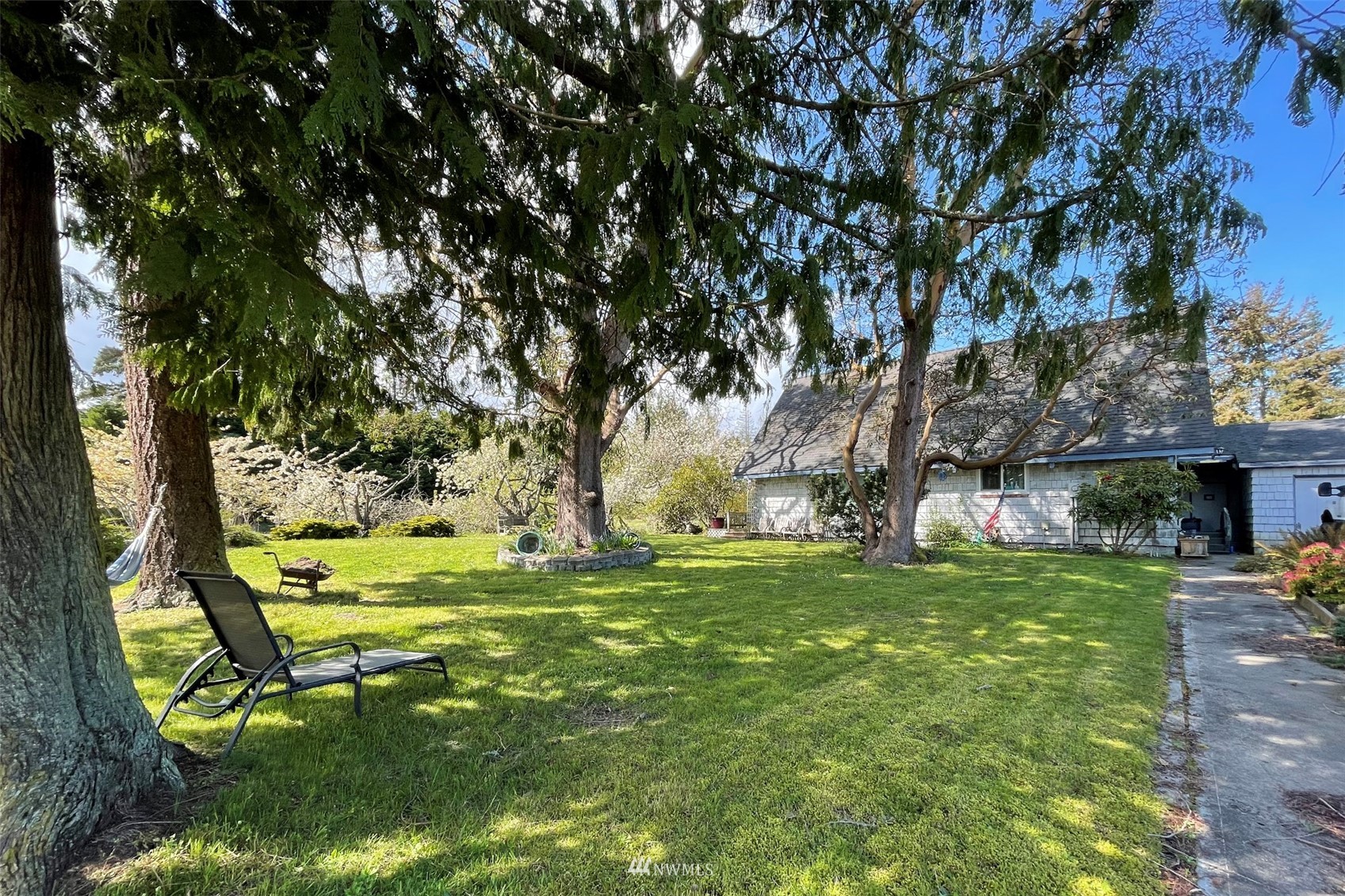 371 Lake Farm Road Port Angeles, WA 98362 - Photo 26 of 36 a backyard of a house with yard and outdoor seating