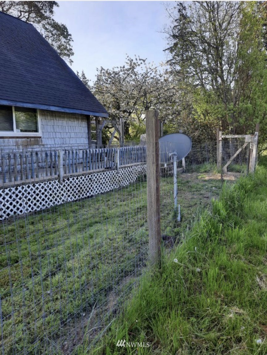 371 Lake Farm Road Port Angeles, WA 98362 - Photo 36 of 36 a backyard of a house with lots of green space and plants