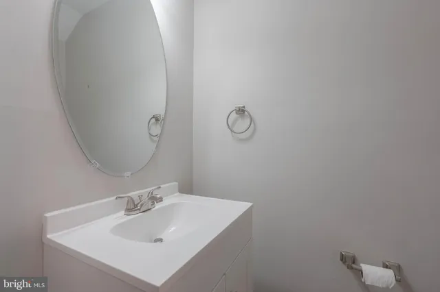 a bathroom with a sink and mirror