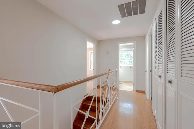 a view of a hallway with stairs