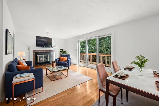 a living room with furniture fireplace and a flat screen tv