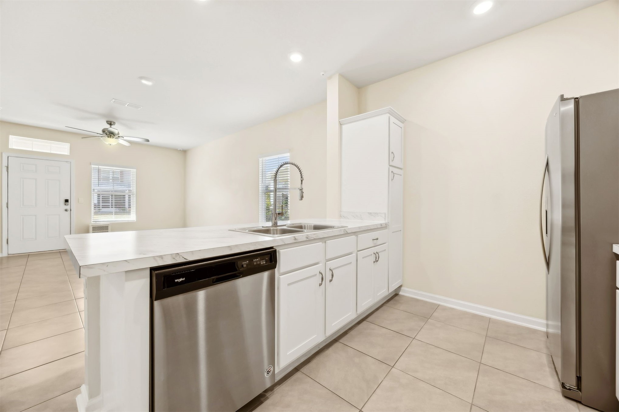 86440 Shortline Circle Yulee, FL 32097 - Photo 12 of 50 a kitchen with stainless steel appliances granite countertop a sink and a refrigerator