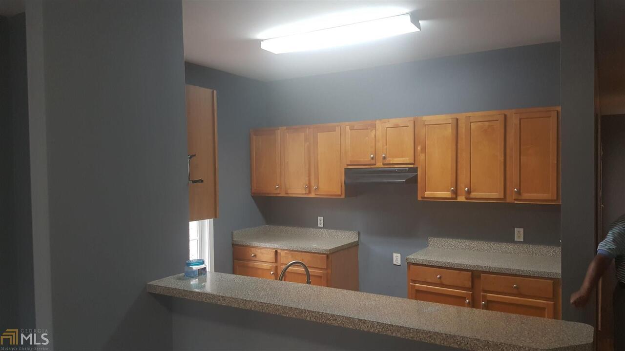 854 Ridge Avenue Northwest, Unit A Atlanta, GA 30318 - Photo 7 of 9 a kitchen with cabinets and window