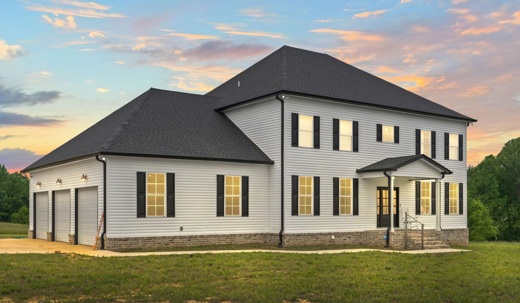 a front view of a house with a yard
