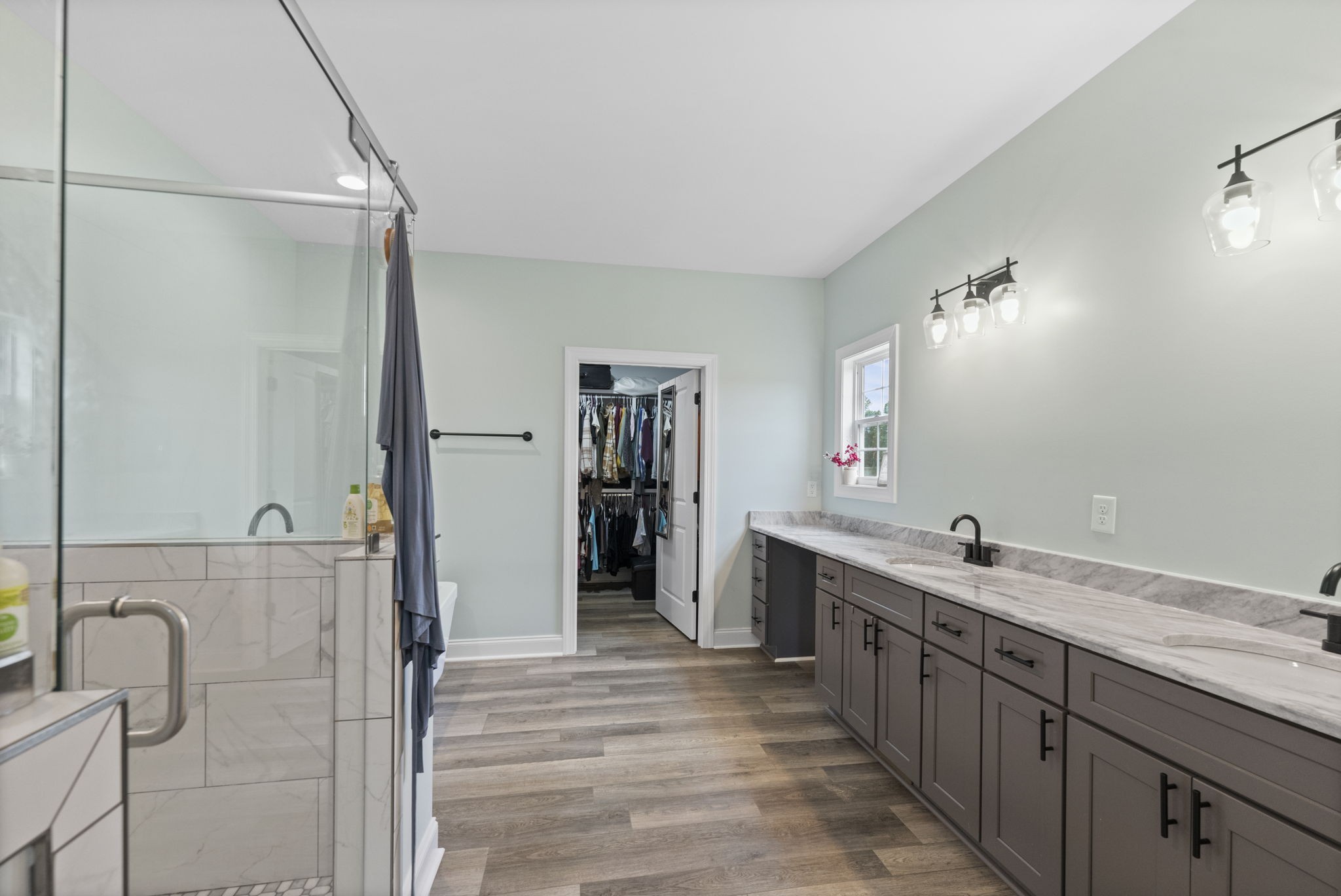 147 Roberts Road Portland, TN 37148 - Photo 15 of 30 a bathroom with a double vanity sink and mirror