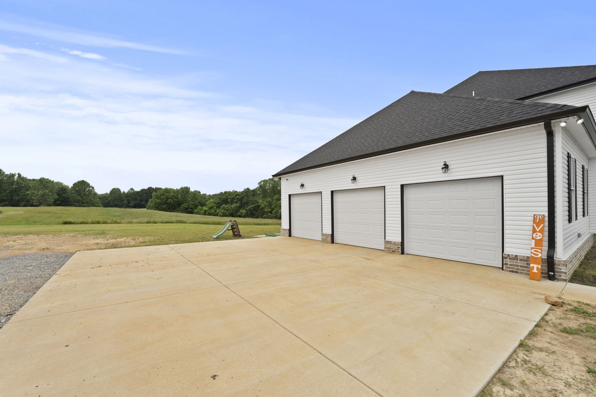 147 Roberts Road Portland, TN 37148 - Photo 2 of 30 a view of a house with a yard and garage